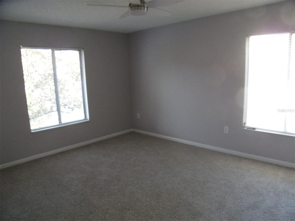 1345 Pine Ridge Circle East, Unit C2 Tarpon Springs, FL 34688 - Photo 16 of 22 an empty room with a window