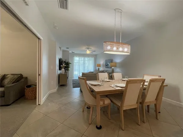 a bathroom with a granite countertop sink a toilet and a shower