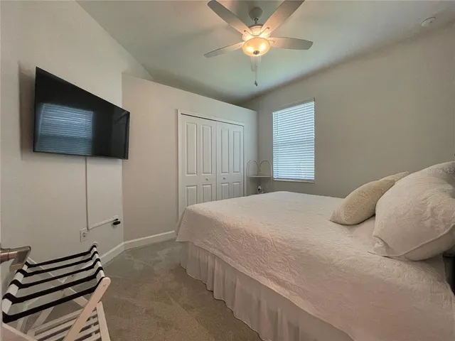 a en suite bathroom with a toilet a sink and mirror