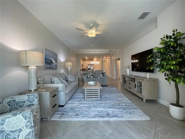 a bedroom with a bed a dresser and night stand