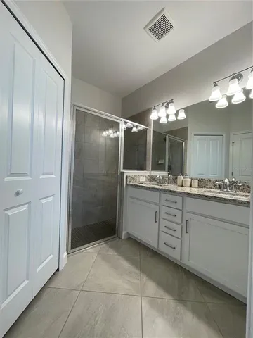 a view of outdoor space with lots of swings and slides