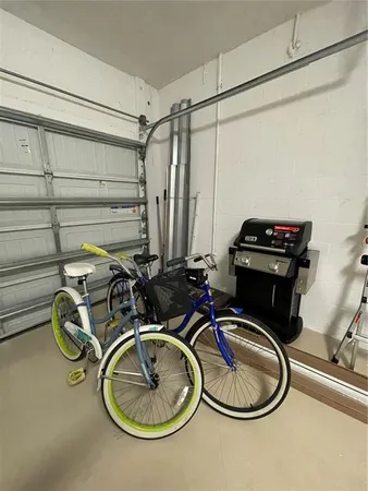 a living room with furniture a window and wooden floor