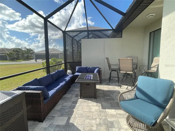 a room with gym equipment and a flat screen tv