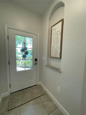 a kitchen with a sink and steel appliances