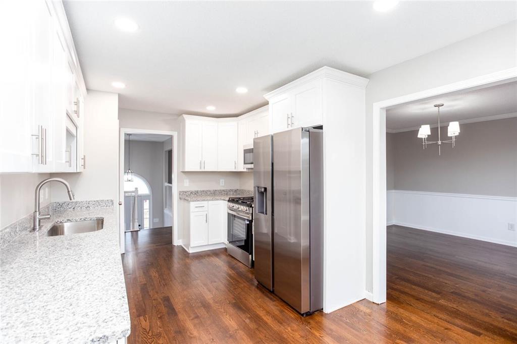 3162 Hadrian Court Powder Springs, GA 30127 - Photo 13 of 49 a kitchen with stainless steel appliances granite countertop a refrigerator and a sink