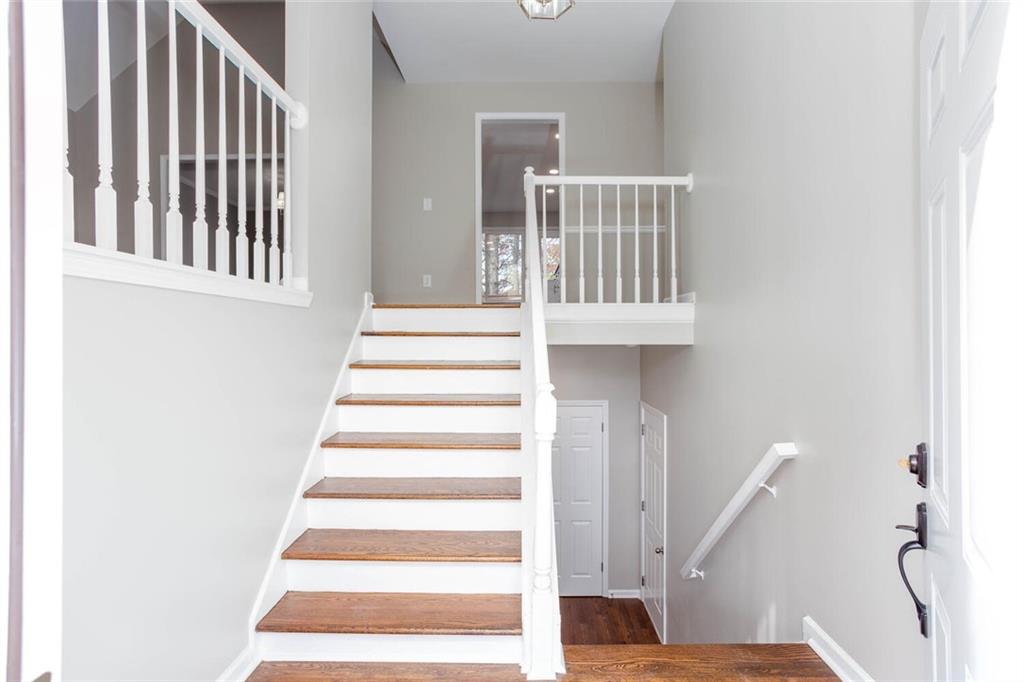 3162 Hadrian Court Powder Springs, GA 30127 - Photo 2 of 49 a view of entryway with wooden floor and front door