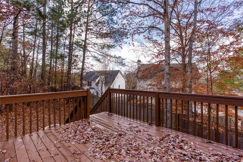 3162 Hadrian Court Powder Springs, GA 30127 - Photo 32 of 49 a view of a balcony with wooden fence and floor