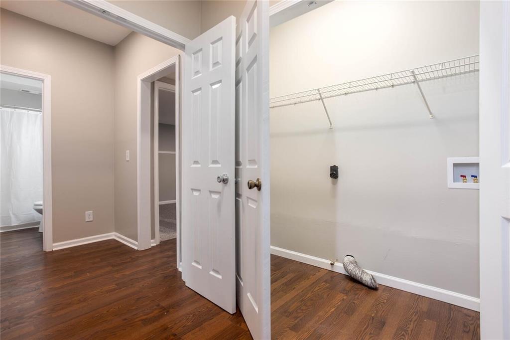 3162 Hadrian Court Powder Springs, GA 30127 - Photo 35 of 49 a view of a bathroom with wooden floor and a shower