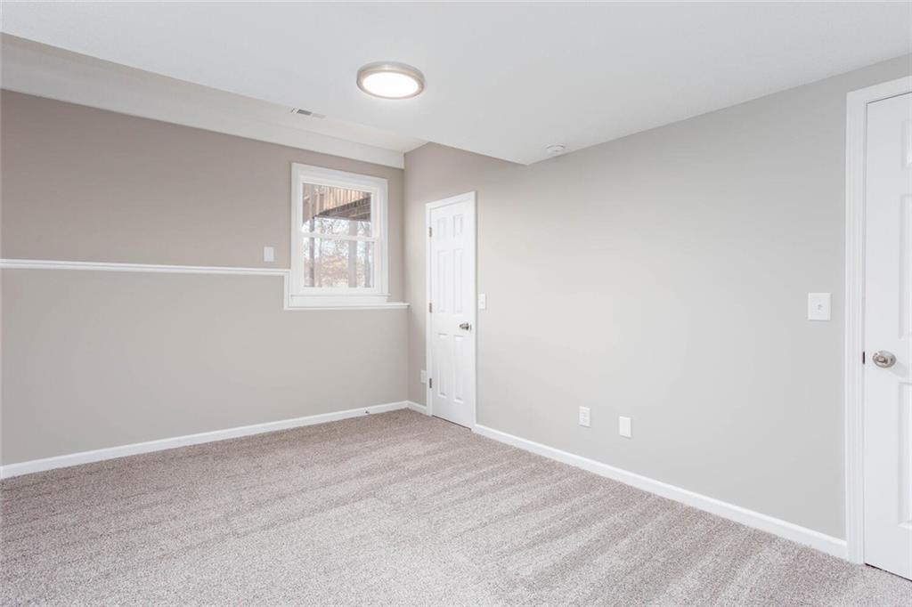 3162 Hadrian Court Powder Springs, GA 30127 - Photo 40 of 49 a view of an empty room with a window