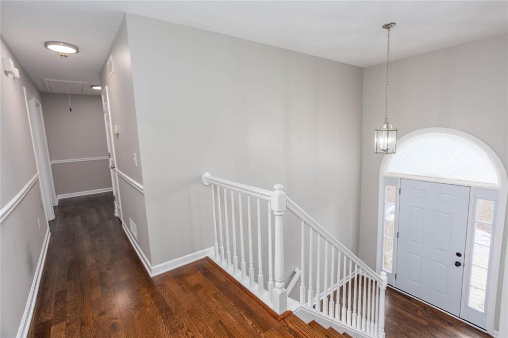 3162 Hadrian Court Powder Springs, GA 30127 - Photo 4 of 49 a view of a hallway view with wooden floor and staircase