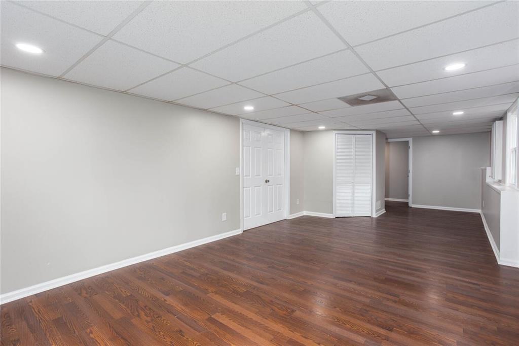 3162 Hadrian Court Powder Springs, GA 30127 - Photo 44 of 49 a view of an empty room with wooden floor