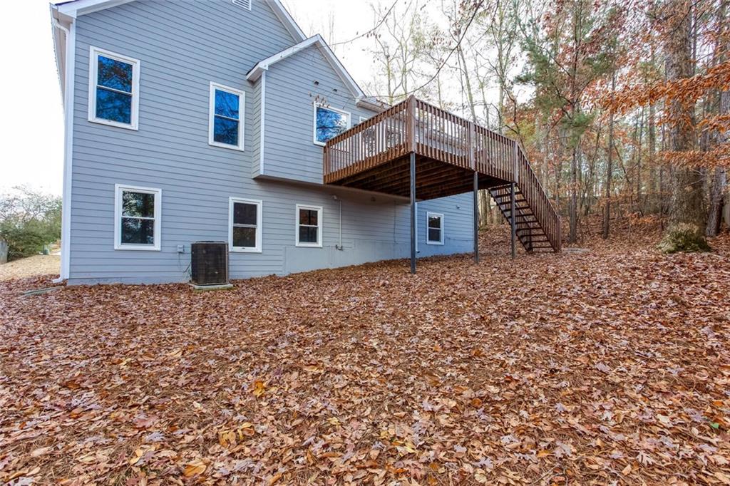 3162 Hadrian Court Powder Springs, GA 30127 - Photo 46 of 49 a house with trees in front of it