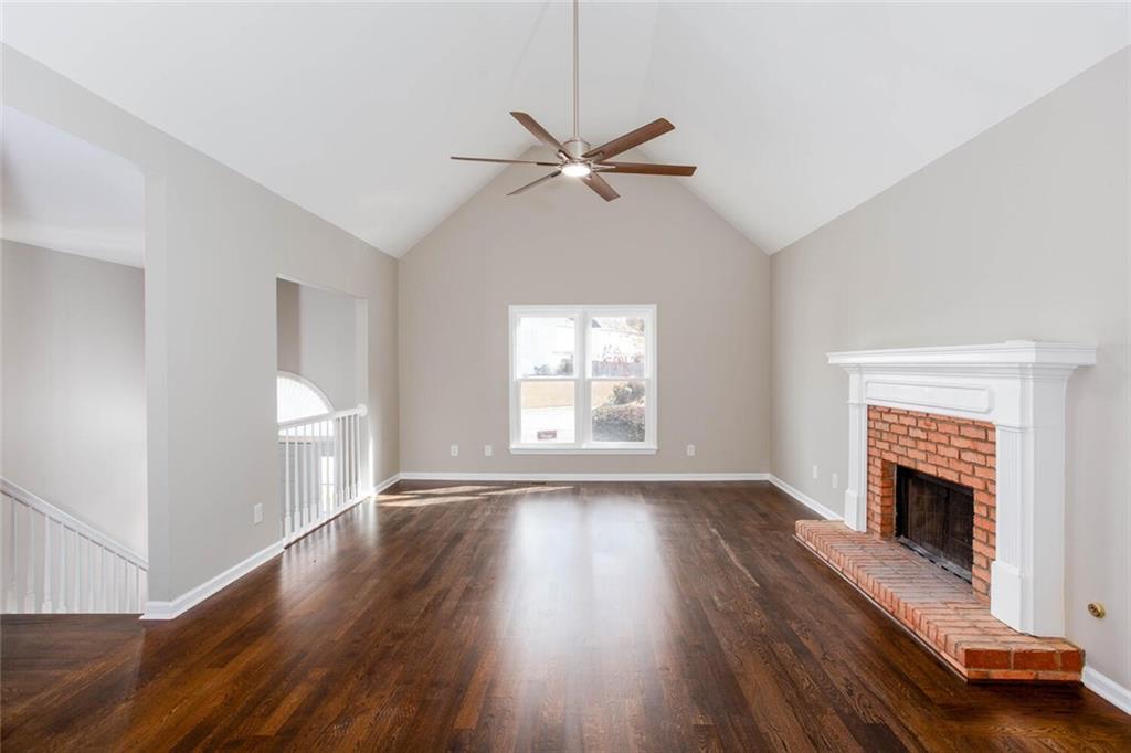 3162 Hadrian Court Powder Springs, GA 30127 - Photo 6 of 49 a view of empty room with wooden floor and fan