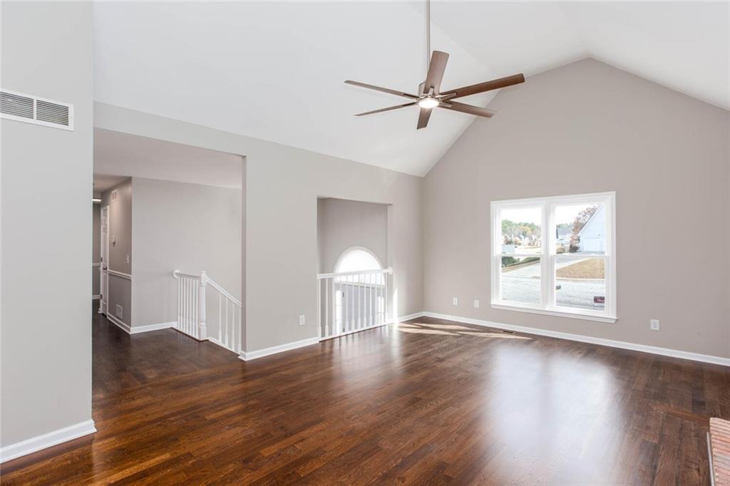 3162 Hadrian Court Powder Springs, GA 30127 - Photo 7 of 49 a view of a room with wooden floor closet and windows