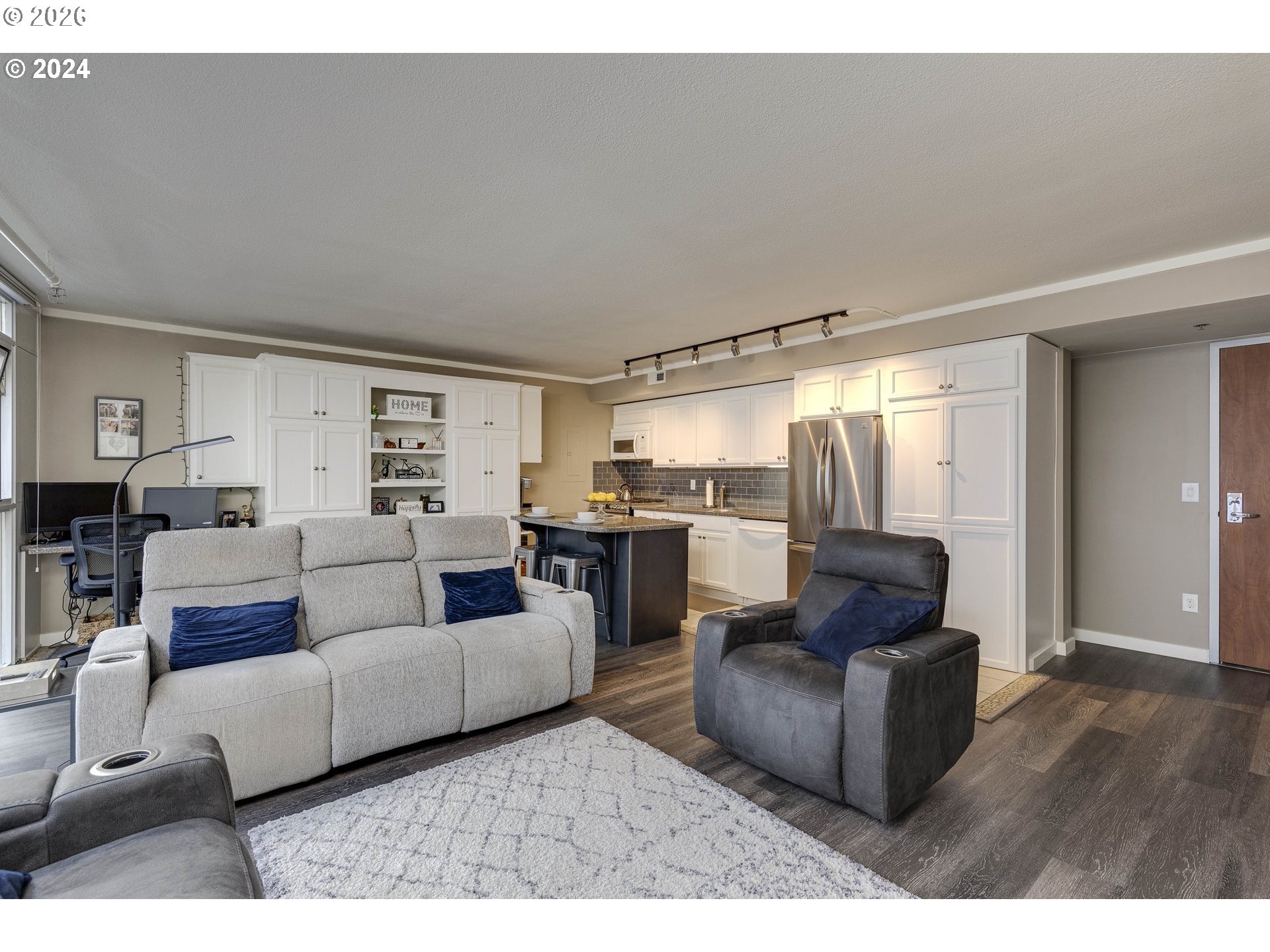 533 Northeast Holladay Street, Unit 409 Portland, OR 97232 - Photo 12 of 38 a living room with furniture and a large window