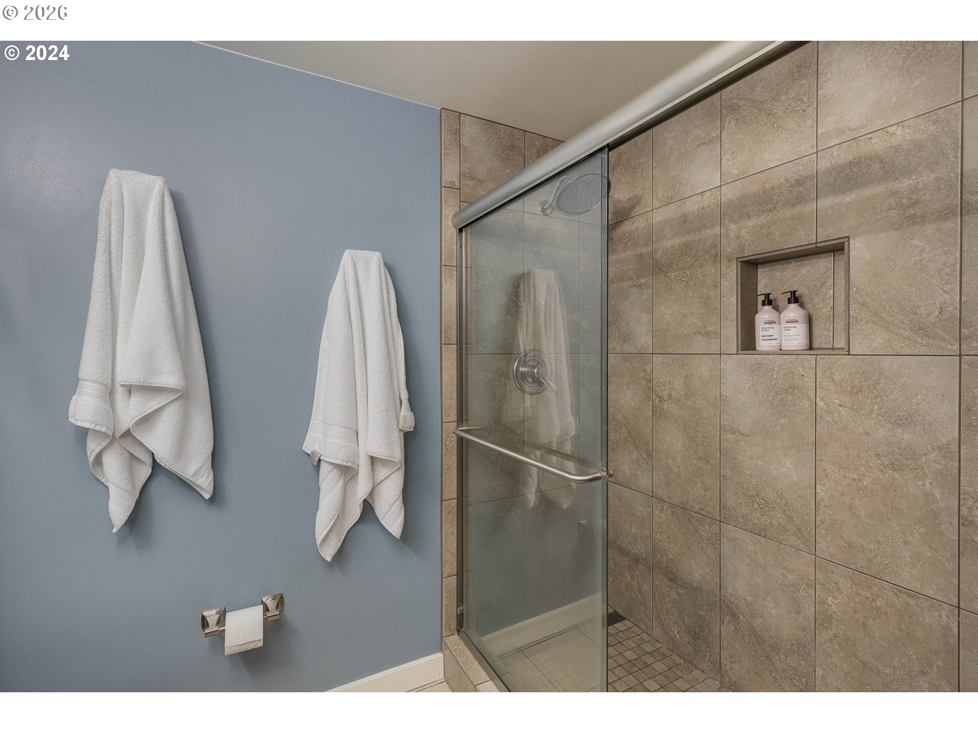 533 Northeast Holladay Street, Unit 409 Portland, OR 97232 - Photo 16 of 38 a bathroom with a sink and a mirror