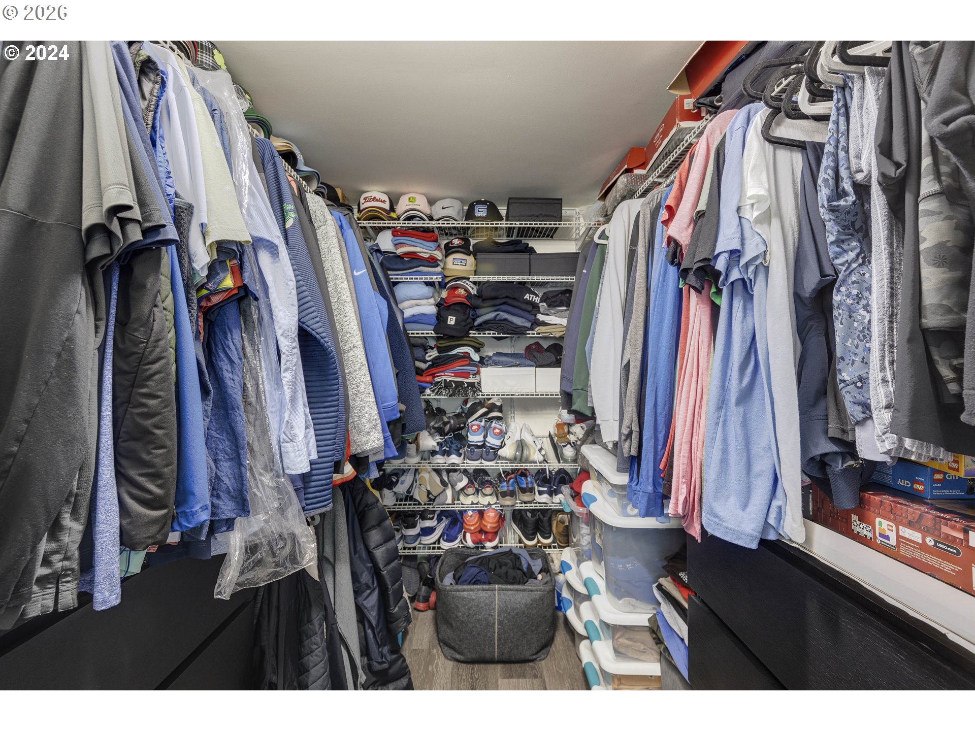 533 Northeast Holladay Street, Unit 409 Portland, OR 97232 - Photo 20 of 38 a view of walk in closet with clothes