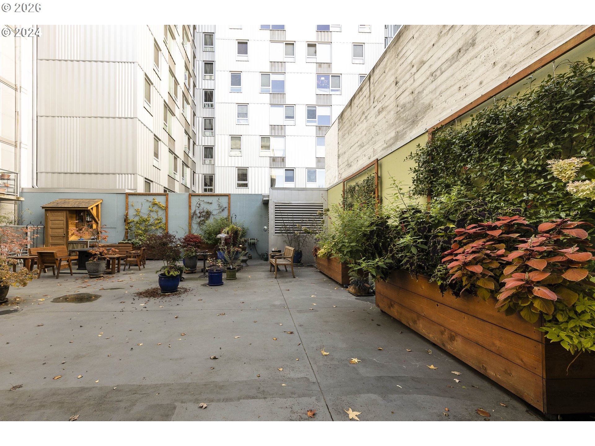 533 Northeast Holladay Street, Unit 409 Portland, OR 97232 - Photo 26 of 38 a view of a chairs with a table in the patio