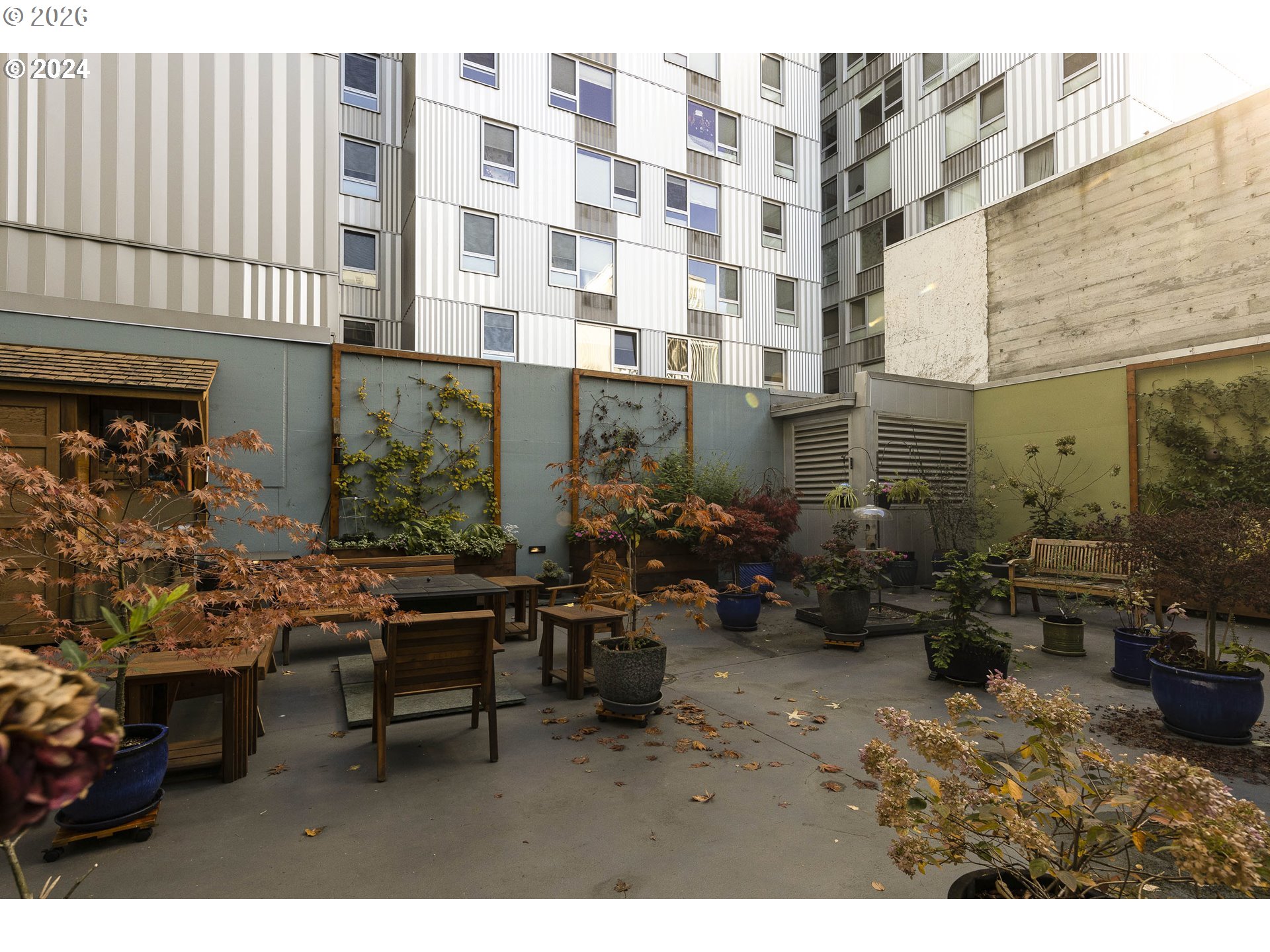 533 Northeast Holladay Street, Unit 409 Portland, OR 97232 - Photo 28 of 38 a view of a chairs and tables in patio