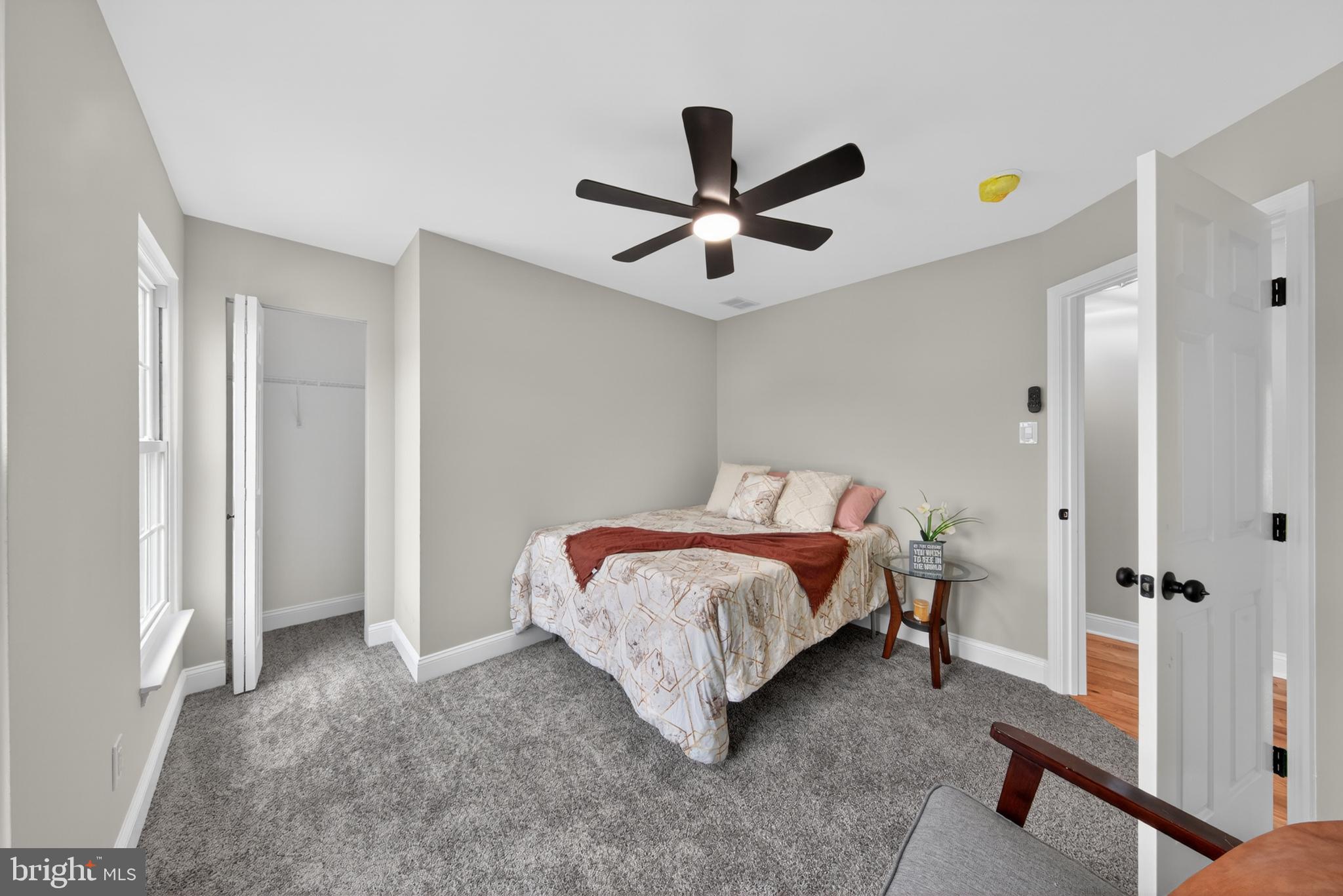 20 Baywatch Road New Castle, DE 19720 - Photo 57 of 76 a bedroom with a bed and a chandelier