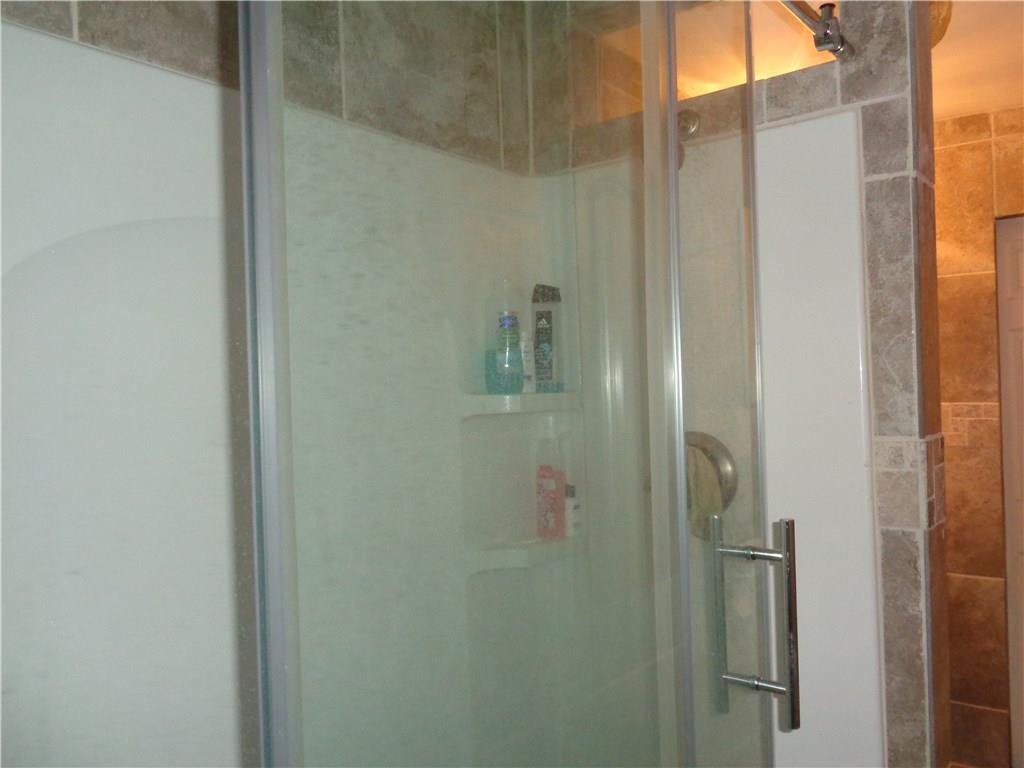 528 Dean Street Confluence, PA 15424 - Photo 14 of 22 New shower with large glass siding doors.