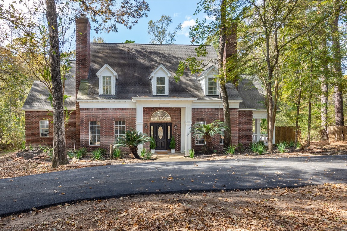 a view of house with a yard