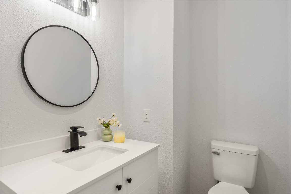 40111 Roundup Road Magnolia, TX 77354 - Photo 18 of 42 a bathroom with a sink and a mirror