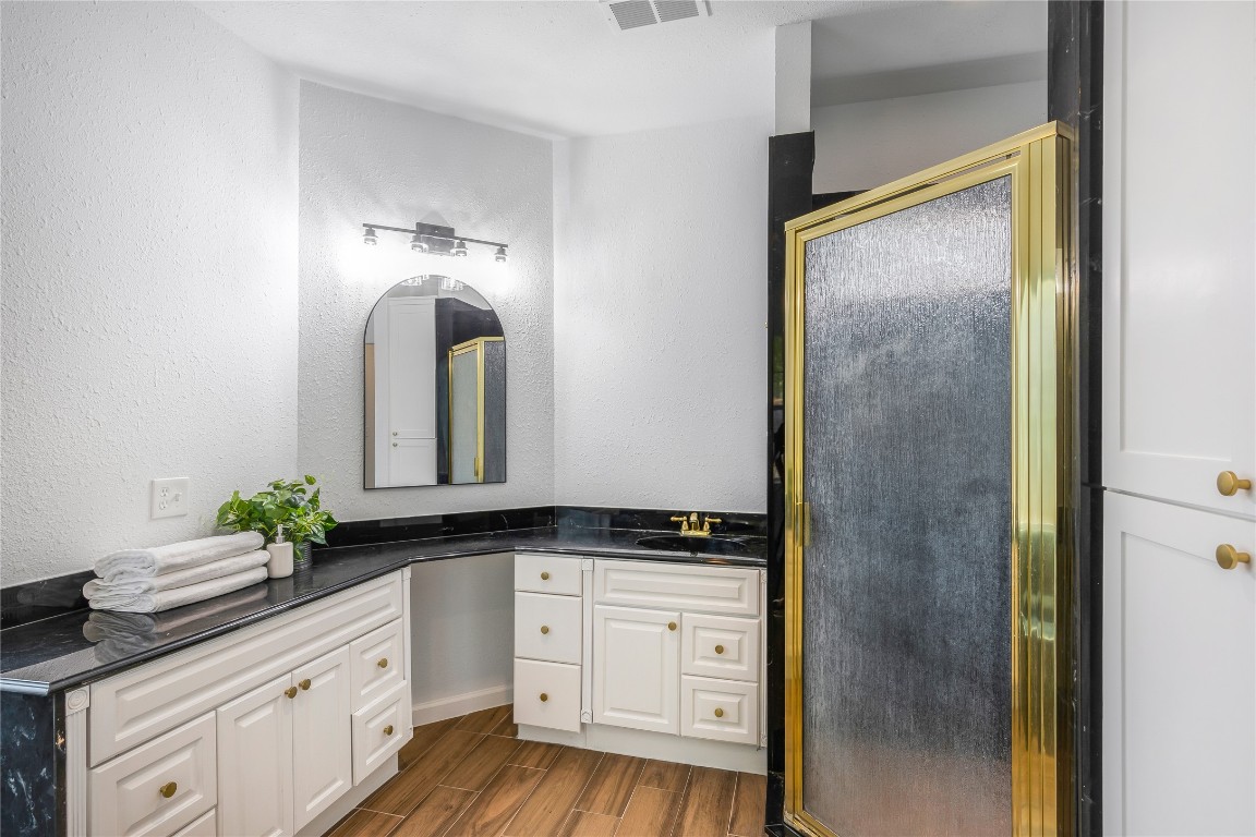 40111 Roundup Road Magnolia, TX 77354 - Photo 22 of 42 a bathroom with a granite countertop sink and a mirror