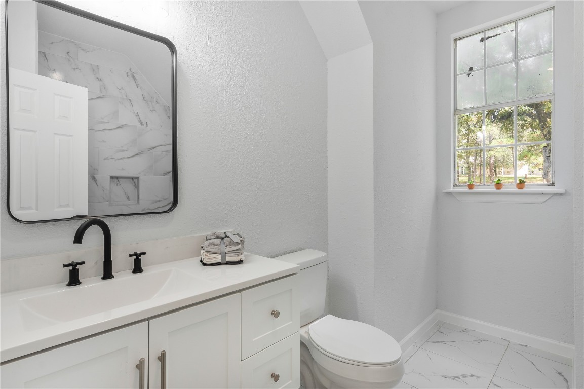 40111 Roundup Road Magnolia, TX 77354 - Photo 25 of 42 a bathroom with a sink a toilet and shower