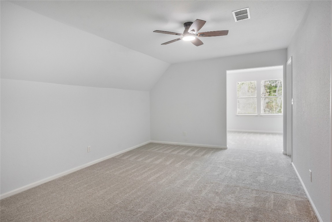 40111 Roundup Road Magnolia, TX 77354 - Photo 27 of 42 a view of an empty room with a window