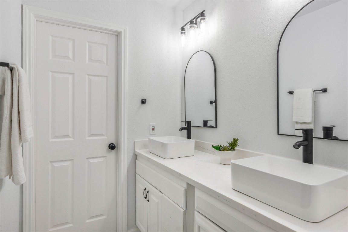 40111 Roundup Road Magnolia, TX 77354 - Photo 29 of 42 a bathroom with a sink a mirror and vanity