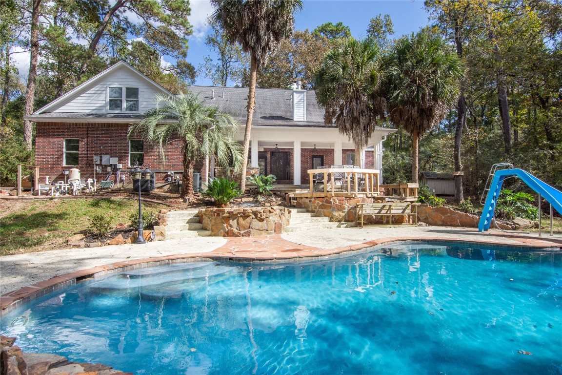 40111 Roundup Road Magnolia, TX 77354 - Photo 38 of 42 a view of a house with pool and sitting area