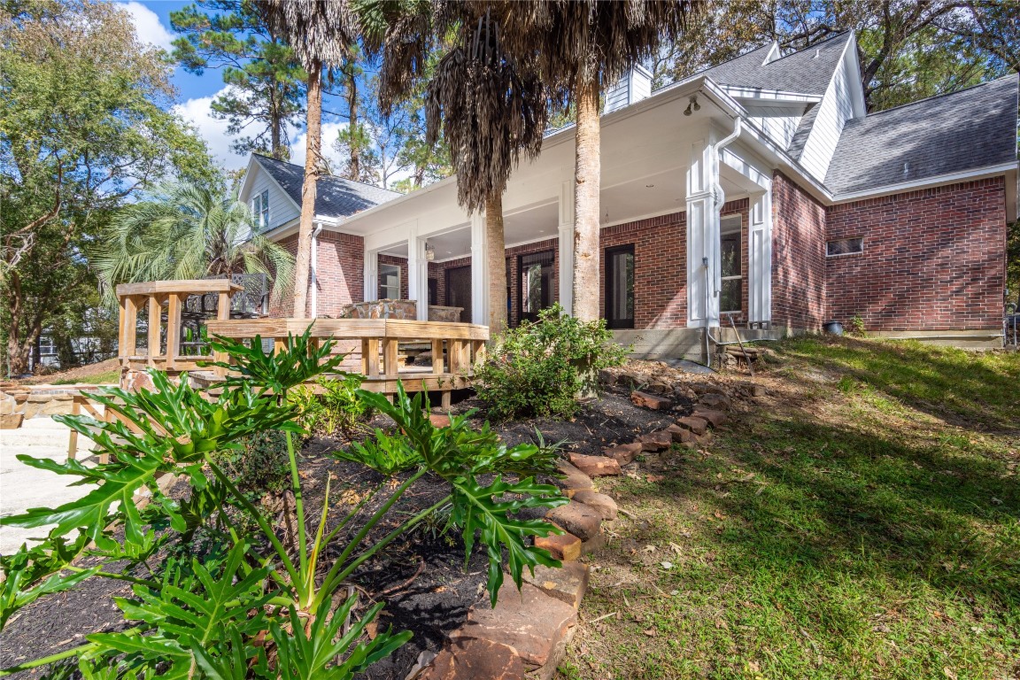 40111 Roundup Road Magnolia, TX 77354 - Photo 42 of 42 a view of a building with a garden
