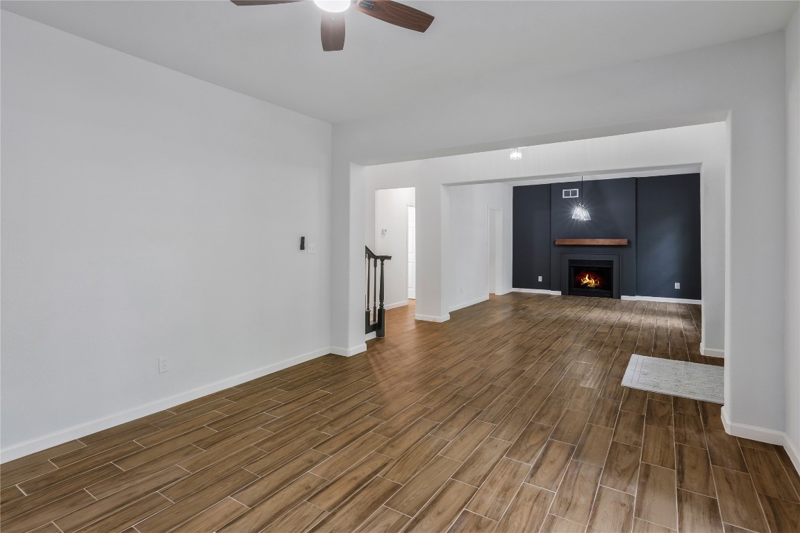 40111 Roundup Road Magnolia, TX 77354 - Photo 9 of 42 a view of empty room with wooden floor