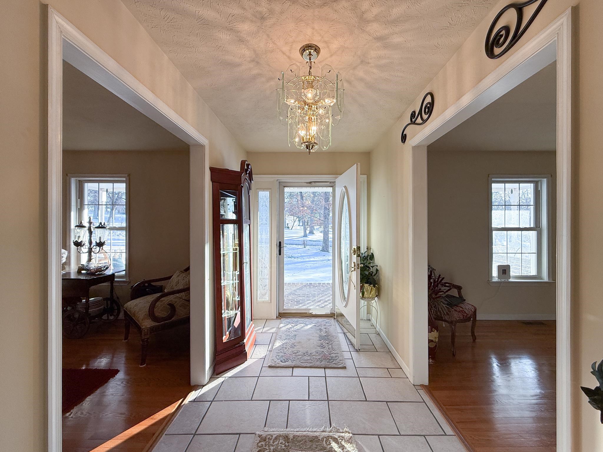 804 Oak Grove Church Road Waynesboro, VA 22980 - Photo 12 of 28 a view of a hallway with wooden floor and living room