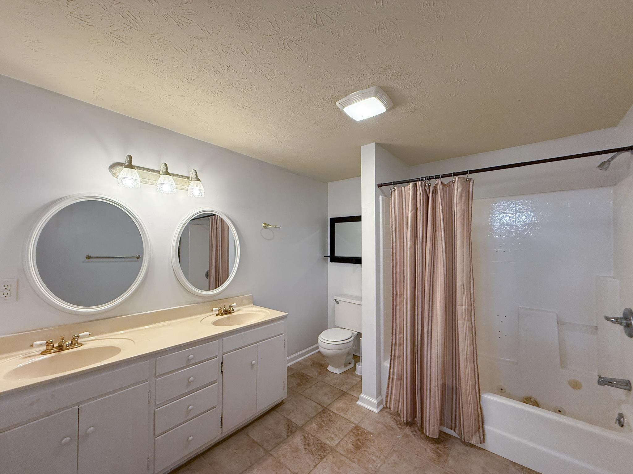 804 Oak Grove Church Road Waynesboro, VA 22980 - Photo 24 of 28 a bathroom with a double vanity sink and a mirror