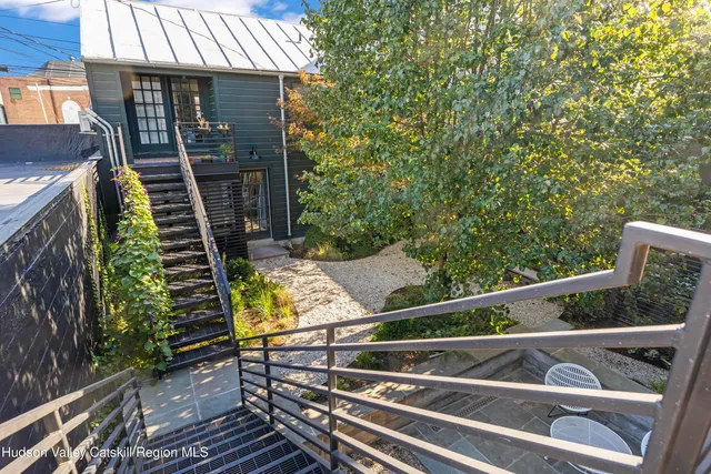 a view of a balcony with chairs