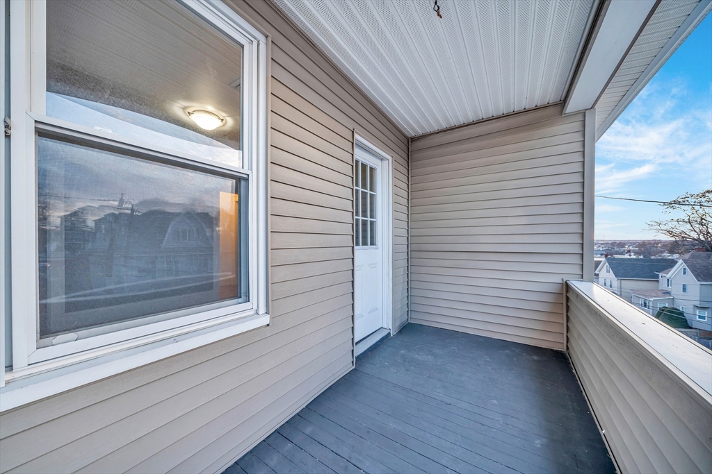127 Henry Avenue, Unit 2B Lynn, MA 01902 - Photo 4 of 10 a view of a balcony with a door