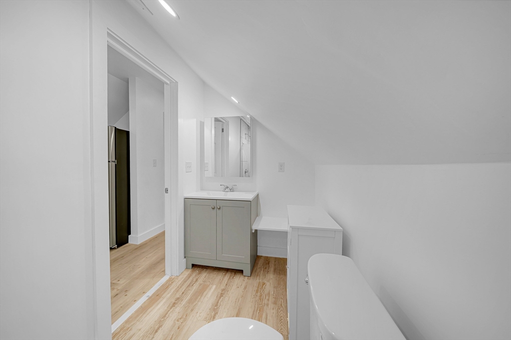 127 Henry Avenue, Unit 2B Lynn, MA 01902 - Photo 8 of 10 a bathroom with a sink toilet and tub