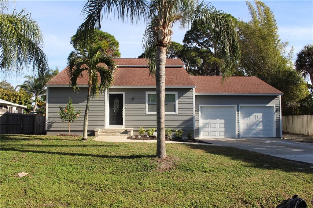 1511 Hudson Road Venice, FL 34293 - Photo 1 of 1 a front view of a house with garden