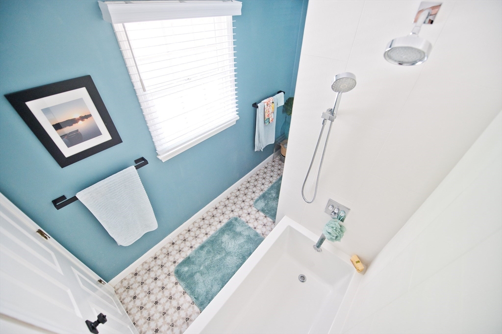 16 Warren Avenue Newton, MA 02465 - Photo 21 of 42 a white bath tub sitting next to a white sink
