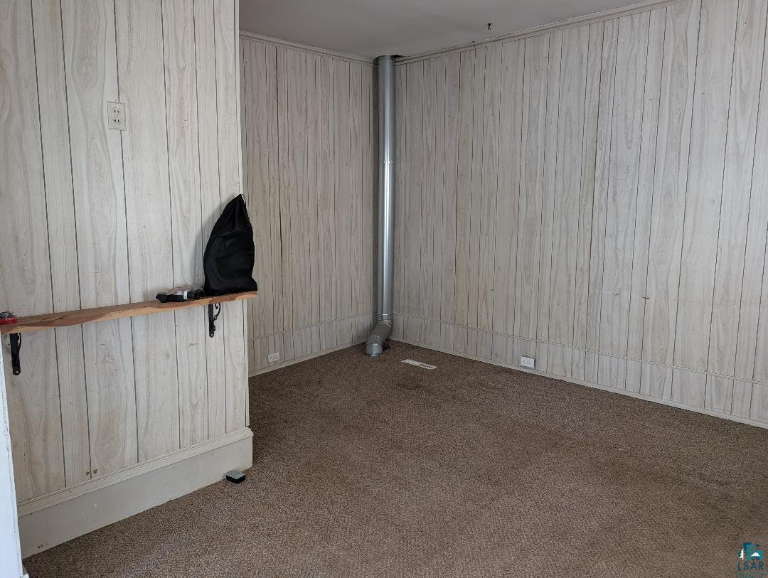 513 South Main Street Mellen, WI 54546 - Photo 12 of 22 Room featuring paneled walls and carpeted flooring