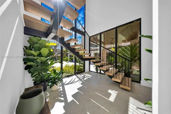 an aerial view of a house with yard swimming pool and outdoor seating