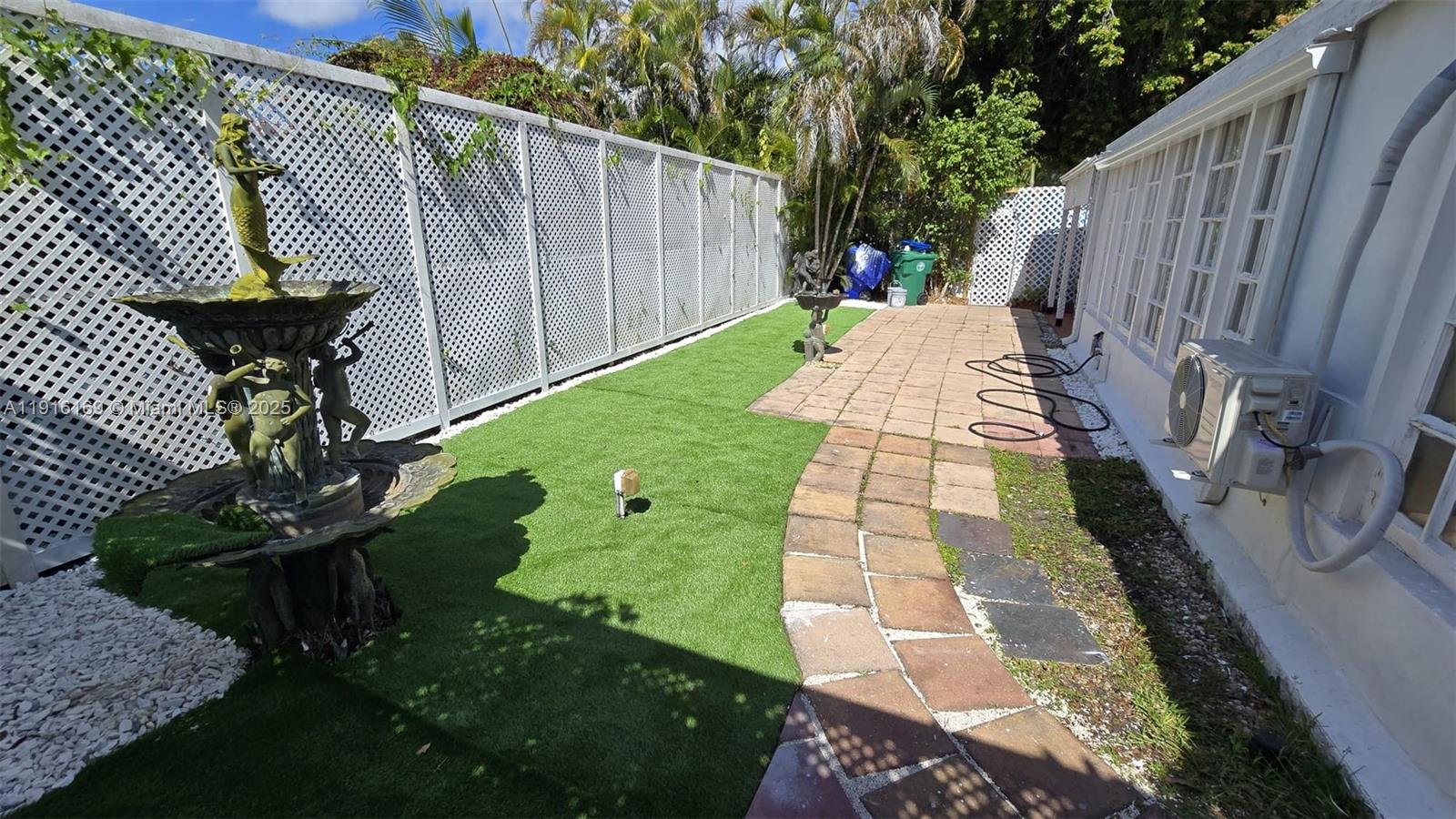 1901 Southwest 2nd Avenue, Unit 1 Miami, FL 33129 - Photo 13 of 13 a view of a backyard with wooden fence