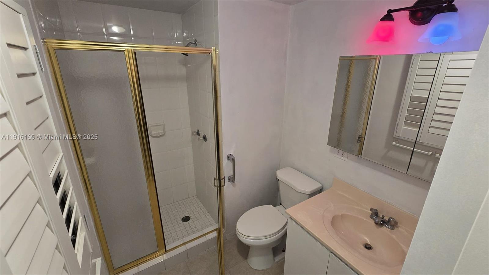 1901 Southwest 2nd Avenue, Unit 1 Miami, FL 33129 - Photo 7 of 13 a bathroom with a sink toilet and shower