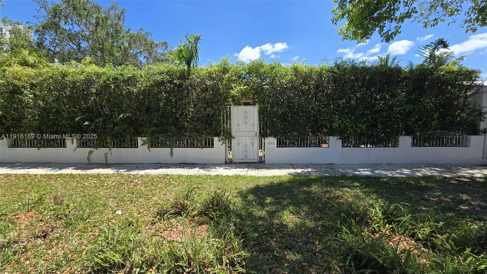 1901 Southwest 2nd Avenue, Unit 1 Miami, FL 33129 - Photo 9 of 13 a view of a tree with a yard