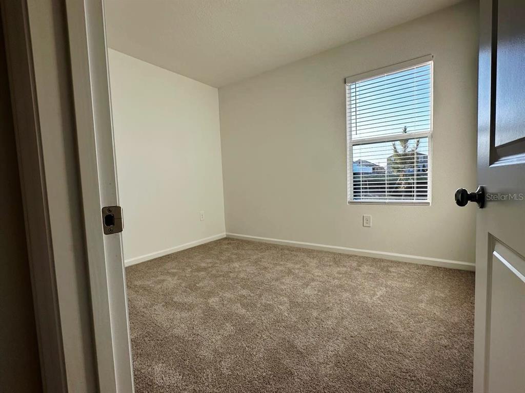 339 Puma Loop Groveland, FL 34736 - Photo 14 of 23 a view of an empty room and a window