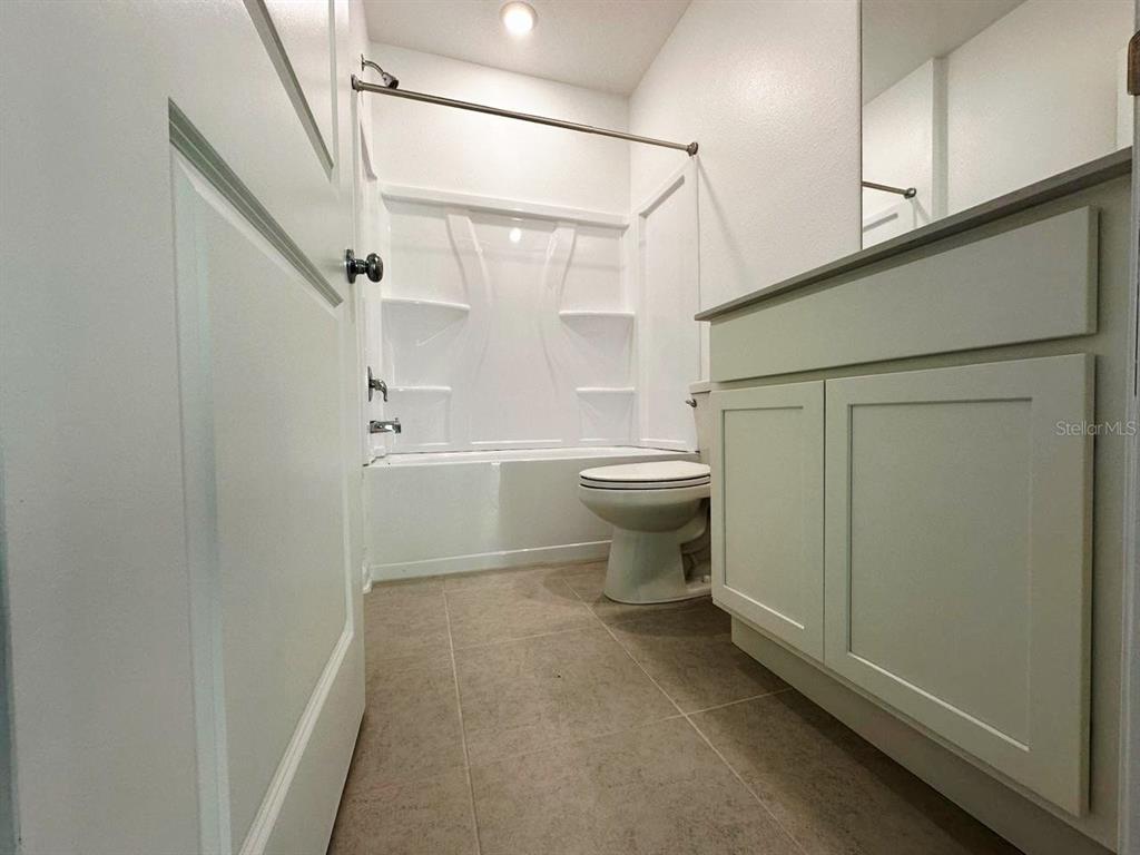 339 Puma Loop Groveland, FL 34736 - Photo 19 of 23 a bathroom with a toilet and a shower