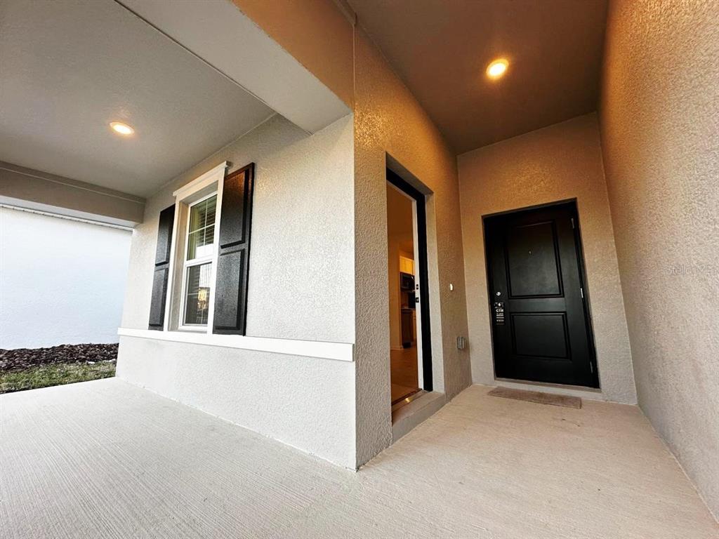 339 Puma Loop Groveland, FL 34736 - Photo 3 of 23 a view of a hallway with wooden shelves