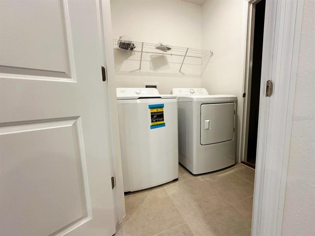 339 Puma Loop Groveland, FL 34736 - Photo 7 of 23 a utility room with dryer and washer